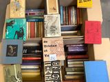 a box full of books that are sitting on the floor