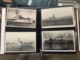 several black and white photos of ships in a case on a table