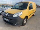 yellow and black van parked in a parking lot next to other cars