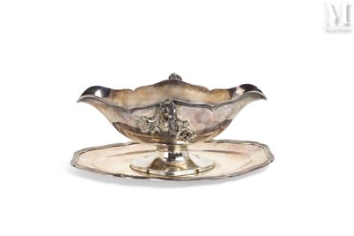 a silver plate with a silver saucer on it
