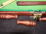 a pool table with a pool cue and a pool ball on it