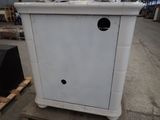 a white cabinet that has a hole in it