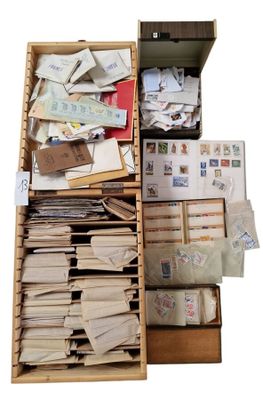 a wooden box filled with lots of mail and stamps