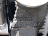 a close up of a motorcycle with a number plate on it