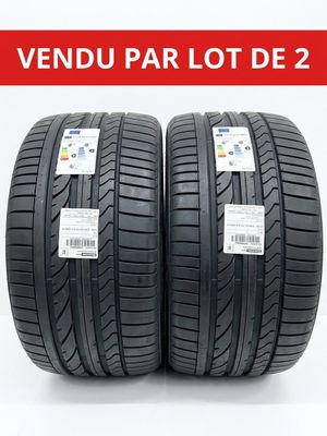 a pair of tires on a white background with the words vendu par lot de 2