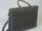 black leather briefcase on white background with strap
