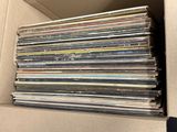a lot of cds in a box on the table