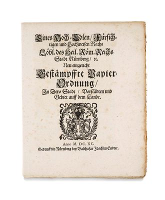 un vieux livre avec une image en noir et blanc d'un blason