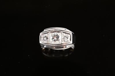 an image of a diamond ring on a black surface
