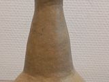 a vase that is sitting on a glass table