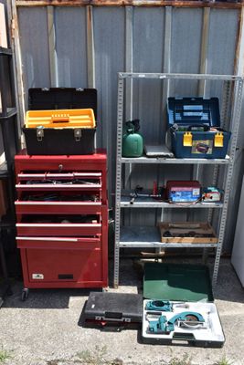 many tools on the shelves in the garage