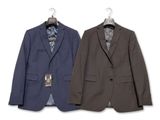 two suits hanging on a hanger next to each other