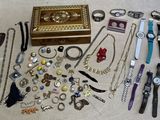 many different types of watches and bracelets laid out on the floor