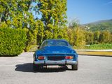 a blue car that is parked in the parking lot