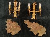pair of antique wall sconces with carved flowers and leaves