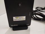 a small black device sitting on a white table