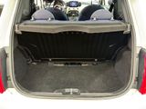 two seats in the back of a car that is open