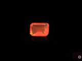 an orange diamond in the dark with a black background