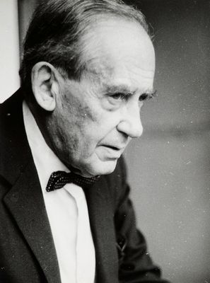 black and white photograph of a man in a suit and bow tie