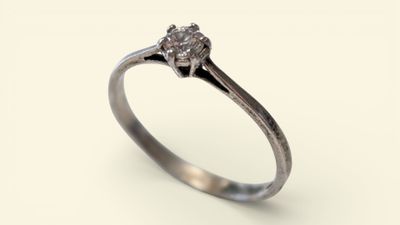 a close up of a diamond ring on a white background