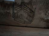 a wire basket hanging from the ceiling of a room