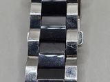 a close up of a watch on a table