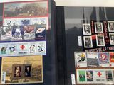 a lot of stamps on display in a glass case