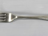 a fork and a spoon sitting on a table