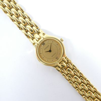 an image of a close up of a wrist watch on a white surface