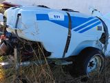 a blue and white tank sitting on the back of a truck