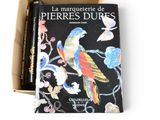 two books in a box one is a parrot and the other is a parrot