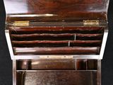 a wooden box that has a metal handle on top of it