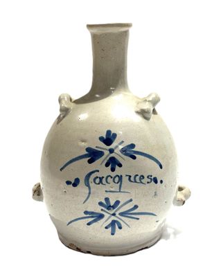 a white vase with a blue design on it