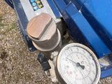 a gauge on the front of a blue truck