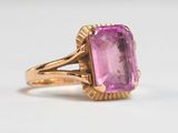 an image of a pink stone ring with a gold band