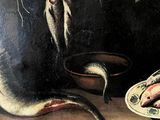 a painting of a fish on a plate next to a plate of fish