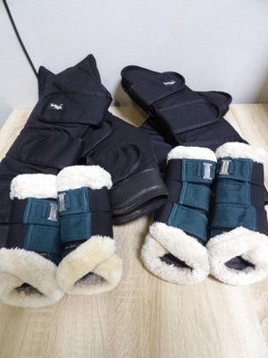 two pairs of boots that are sitting on a table