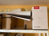 a box on a shelf with a lamp on top of it