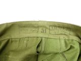 an image of a close up of a green pants with a label on it