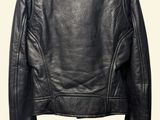 the back of a black leather jacket on a mannequin mannequin mannequin mannequin mannequin mannequin mannequin manne
