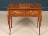 an image of a small wooden table with drawers on it