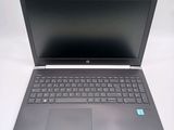a laptop with a keyboard on it sitting on a table