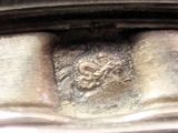 a close up of a metal object with a lion on it