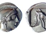 two ancient silver coins with a head of a woman and a horse