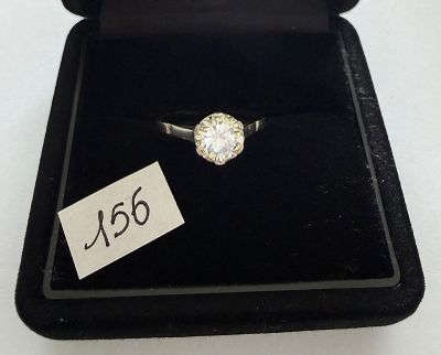 a close up of a diamond ring in a black box with a price tag