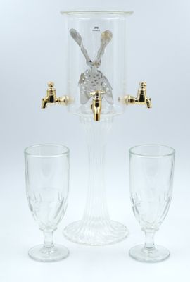 a glass beverage dispenser with a rabbit in it