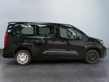 a picture of a black van parked in a room