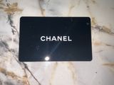 a black card with the word chanel on it