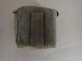 a small pouch that is on a white surface