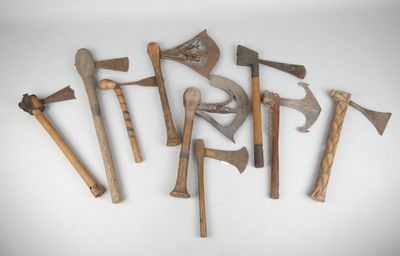 several different types of axes are arranged on a white surface